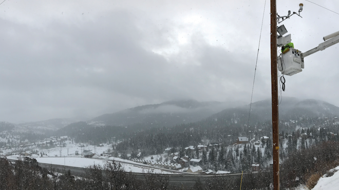 Rocky Mountain Power linemen install a weather station in a high fire-risk area in Park City, Utah.