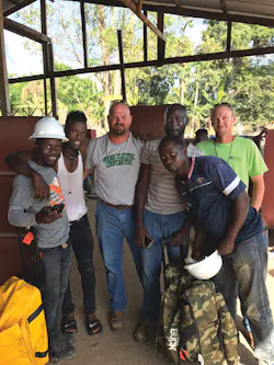 Jeremy Wooden and Jason Toalson worked alongside the local cooperative’s new linemen to build a power line in Liberia. Jeremy Wooden and Jason Toalson worked alongside the local cooperative’s new linemen to build a power line in Liberia.