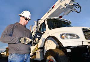 Ryan Corey, a line foreman at Umatilla Electric Cooperative, uses the Esri Survey123 application on an iPad to report on an outage.