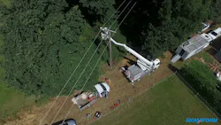 A Sigmaform Switzerland utility crew installs MVLC on a forested area in Geneva, Switzerland. A Sigmaform Switzerland utility crew installs MVLC on a forested area in Geneva, Switzerland.