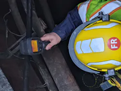 A manhole entrant performs a thermographic and visual assessment of the space to detect any hot spots or other abnormal conditions. A manhole entrant performs a thermographic and visual assessment of the space to detect any hot spots or other abnormal conditions.