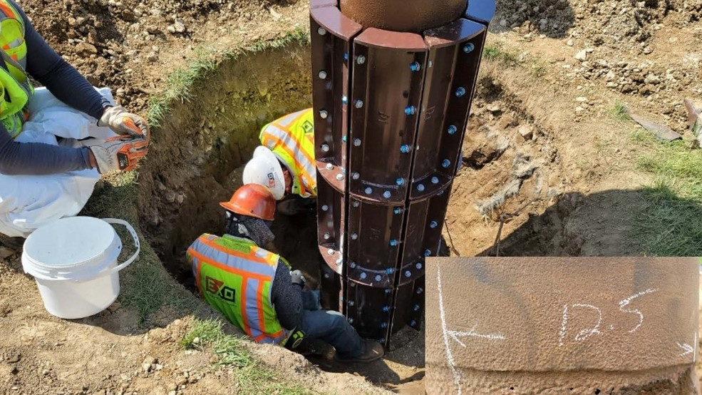 04 After Excavation Technicians Work On Repairing The Pole 6127fefc77933