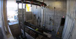 Cribbed rail system was constructed to lower transformers from street into bays, located 4 ft below street level. Cribbed rail system was constructed to lower transformers from street into bays, located 4 ft below street level.