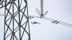 Drone conducts aerial inspection of transmission tower. Drone conducts aerial inspection of transmission tower.