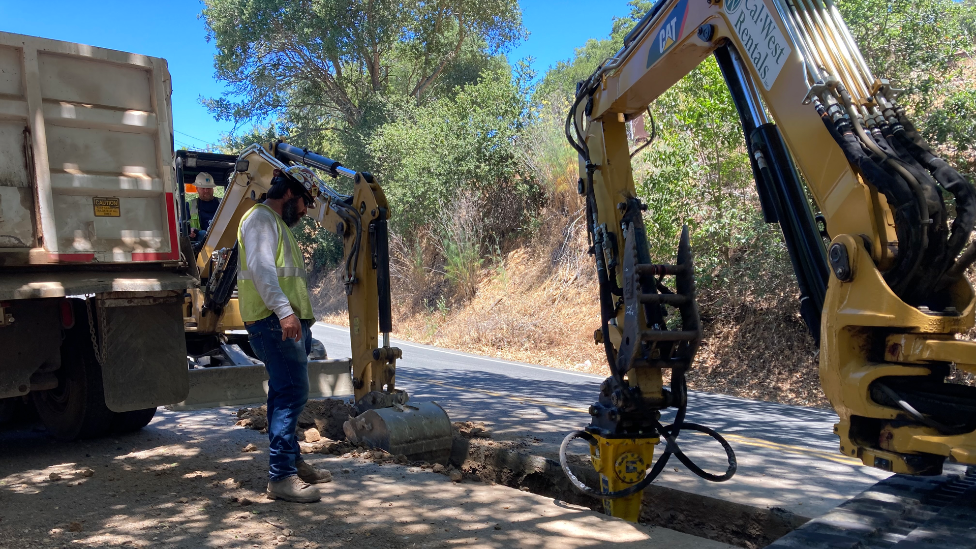 Crew cutting trenches running parallel to existing overhead distribution line. PG&E successfully completed undergrounding nearly 4 miles (6.4 km) of overhead power lines in Santa Rosa, California, U.S.
