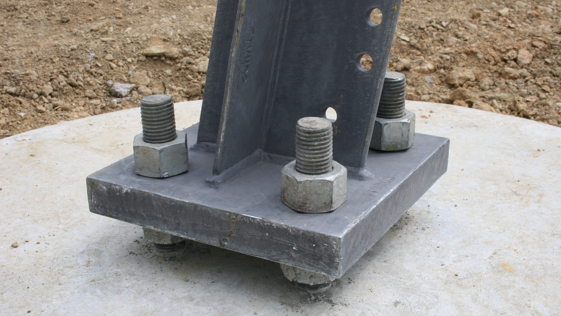 Four bolt base plate that will support a 765kV running corner tower.