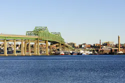 The Braga Bridge crosses the Taunton River near Fall River, Massachusetts. The city was famous in the 19th century as a hub of the U.S. textile industry. The Braga Bridge crosses the Taunton River near Fall River, Massachusetts. The city was famous in the 19th century as a hub of the U.S. textile industry.