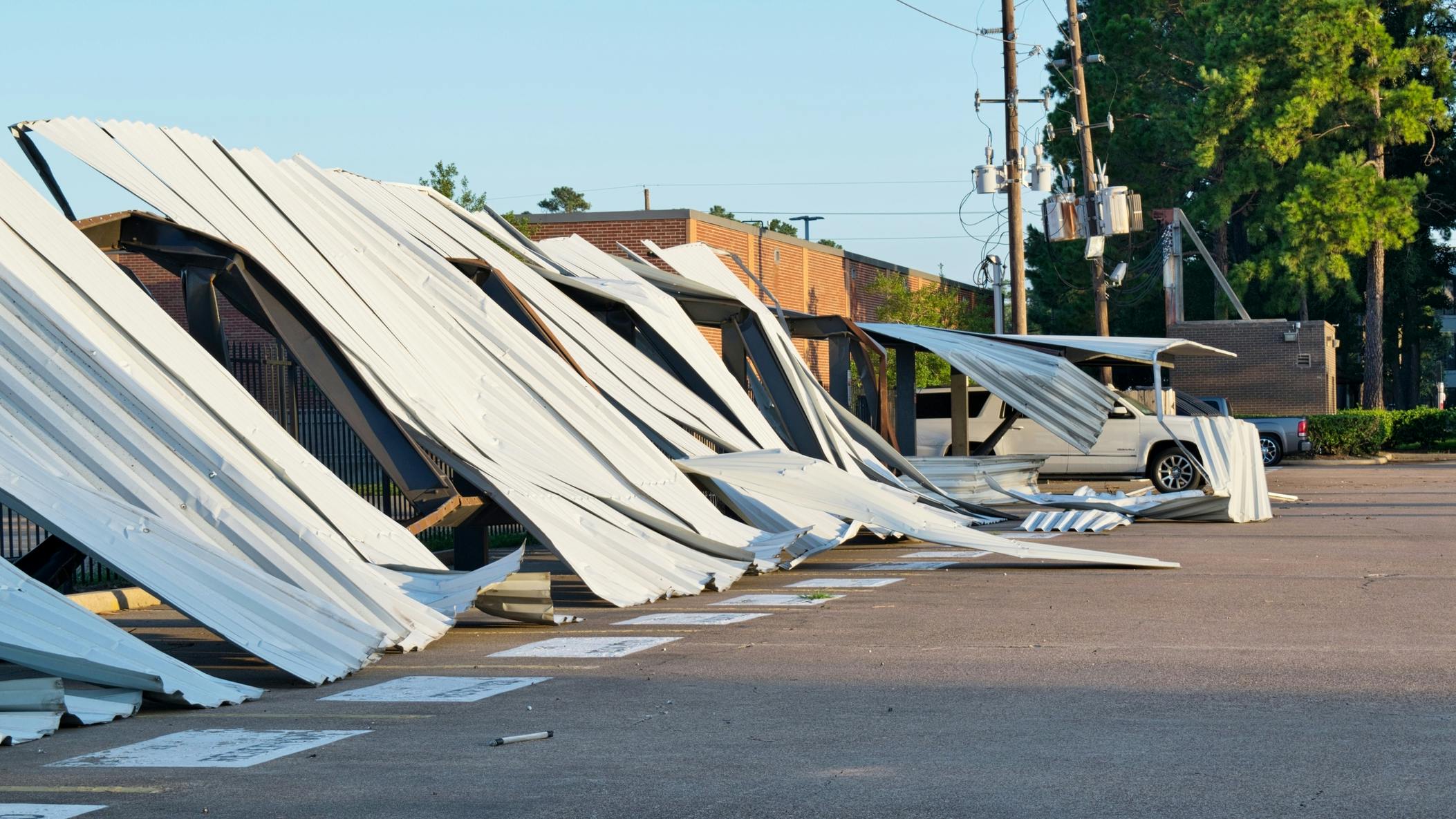 Carports collapsed hurricane Beryl damage power lines transformers.