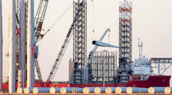 Offshore wind turbine parts being loaded onto supply vessel in the UK. Offshore wind turbine parts being loaded onto supply vessel in the UK.