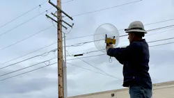 Jon Backman uses the Radar Engineers Parabolic Pinpointer to identify the RFI location on a pole. Jon Backman uses the Radar Engineers Parabolic Pinpointer to identify the RFI location on a pole.