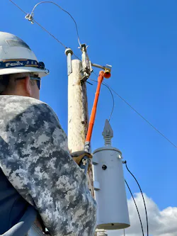 A Radar Engineers hot stick line sniffer tool is used to test for RFI in a porcelain cutout bracket. A Radar Engineers hot stick line sniffer tool is used to test for RFI in a porcelain cutout bracket.