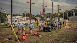 lineworkers standing by power poles lineworkers standing by power poles