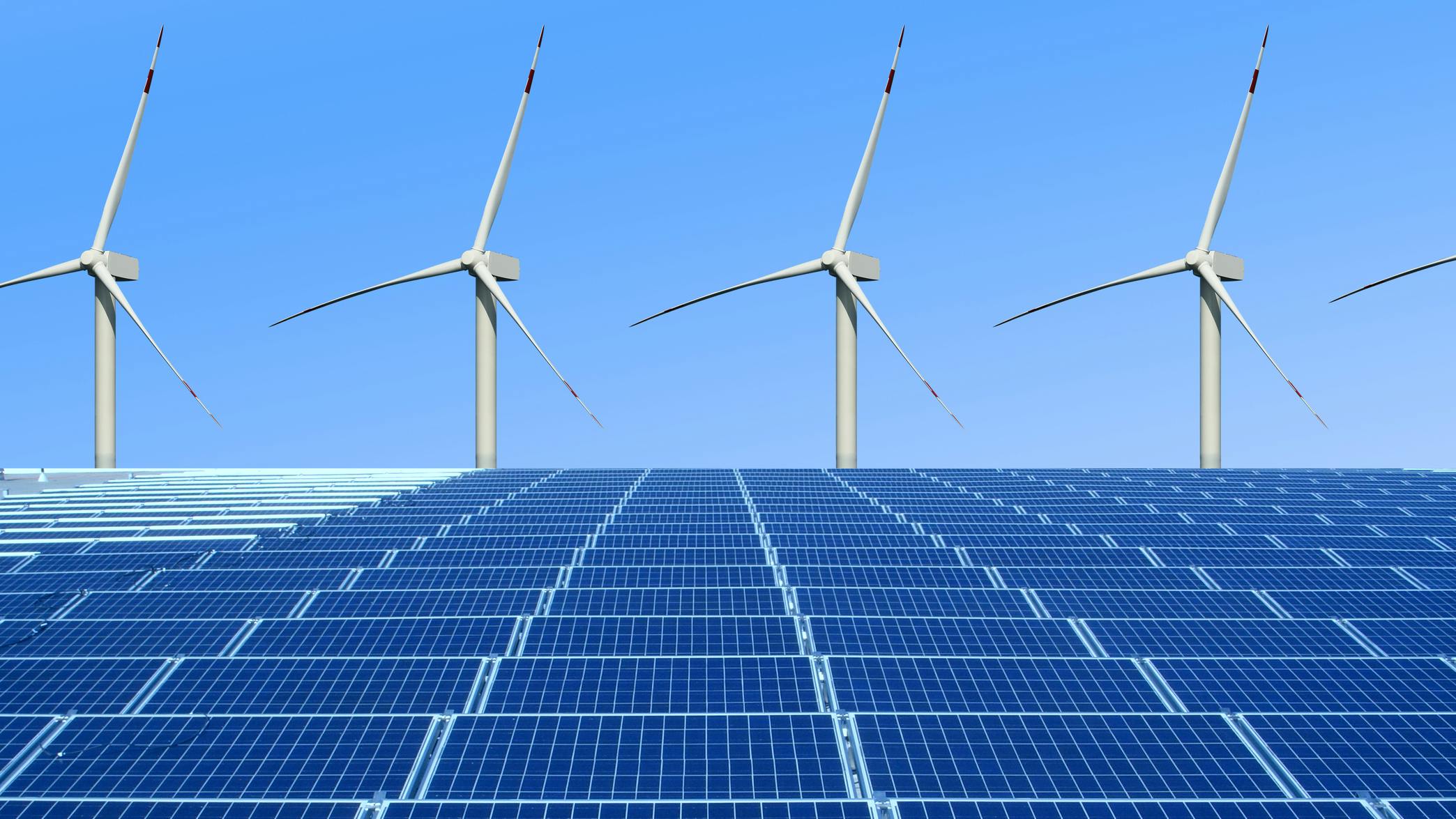 wind turbines above solar panels