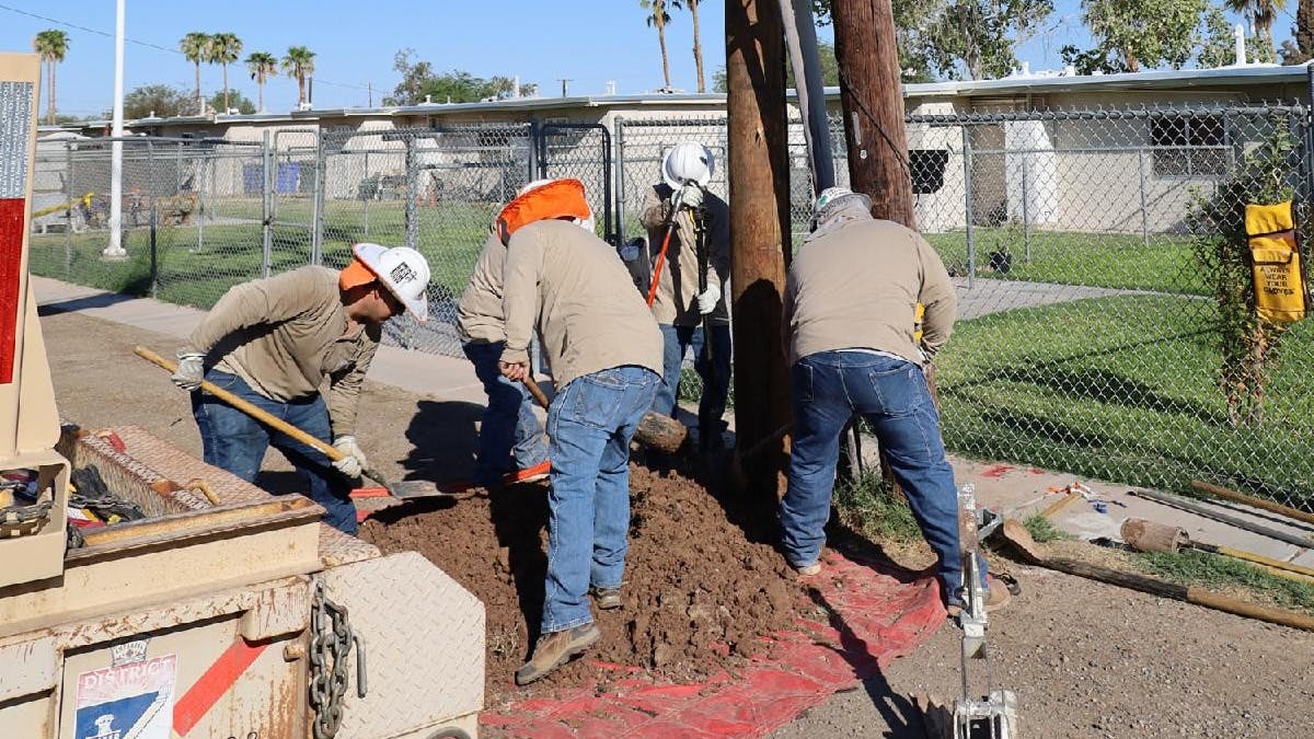 IID line construction crews work to replace a power pole in El Centro.