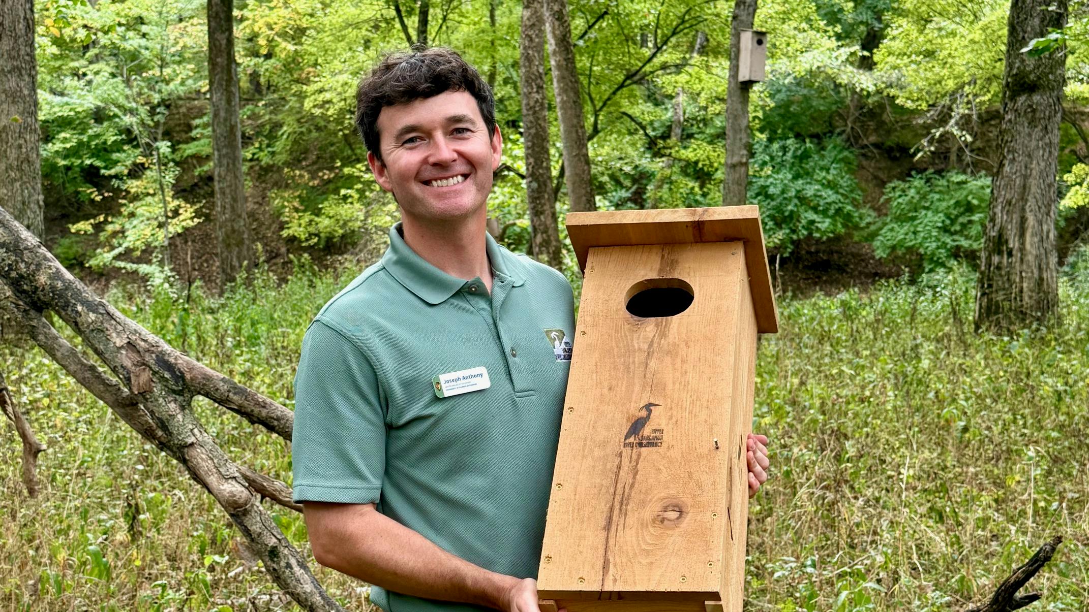 Master Naturalist Joey Anthony shows one of the bluebird boxes he made with his father-in-law from recycled power poles.