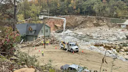 Duke Energy contractors work to get the backbone feeder up in Chimney Rock, Norh Carolina. Duke Energy contractors work to get the backbone feeder up in Chimney Rock, Norh Carolina.
