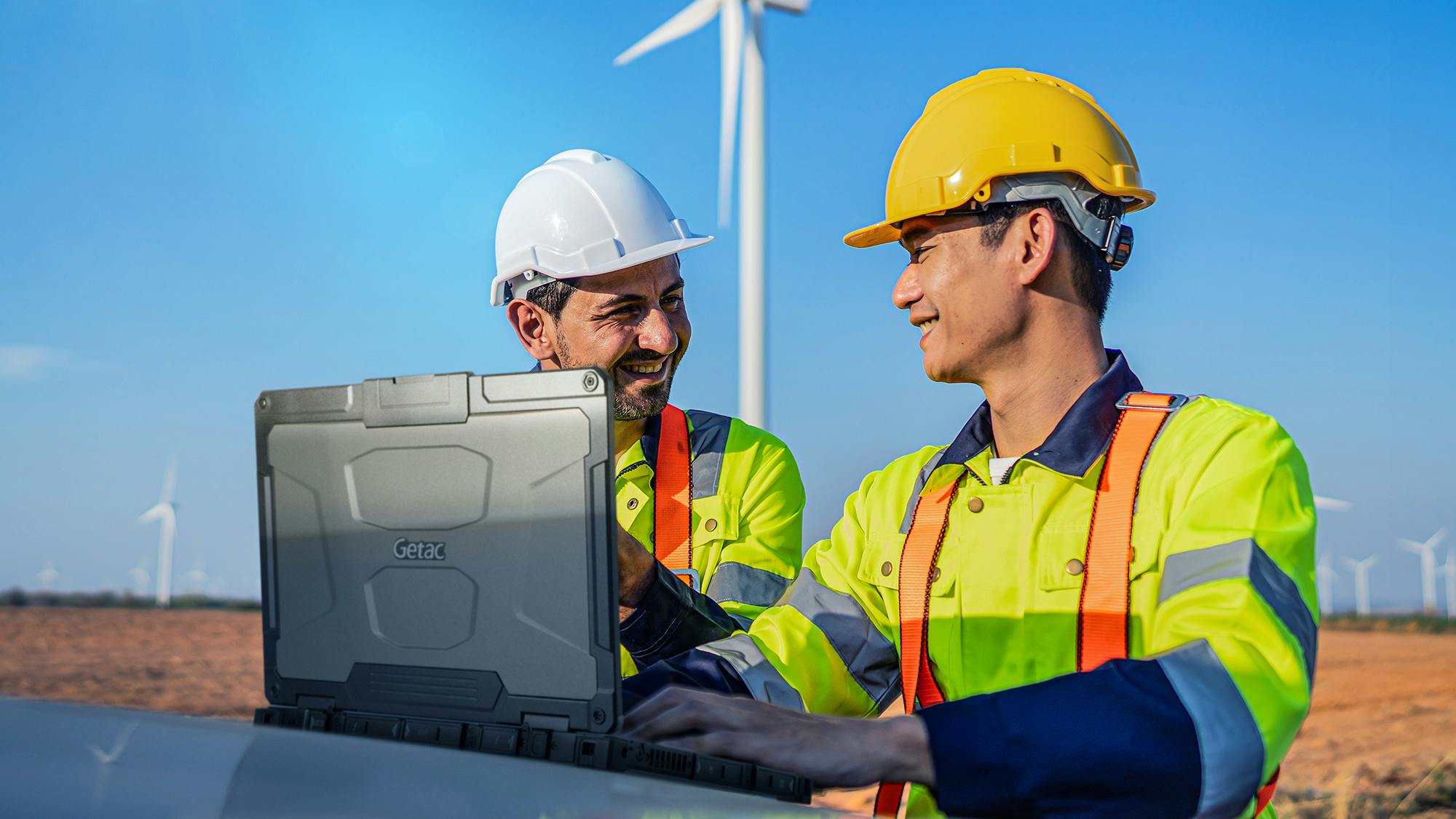 utility workers with rugged laptop