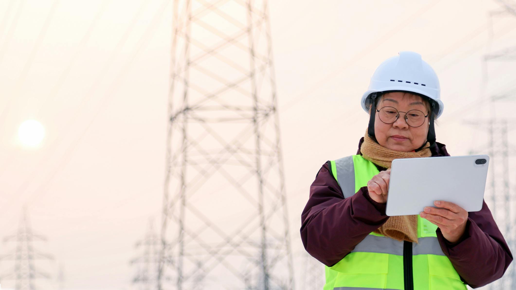 female utility engineer with ipad