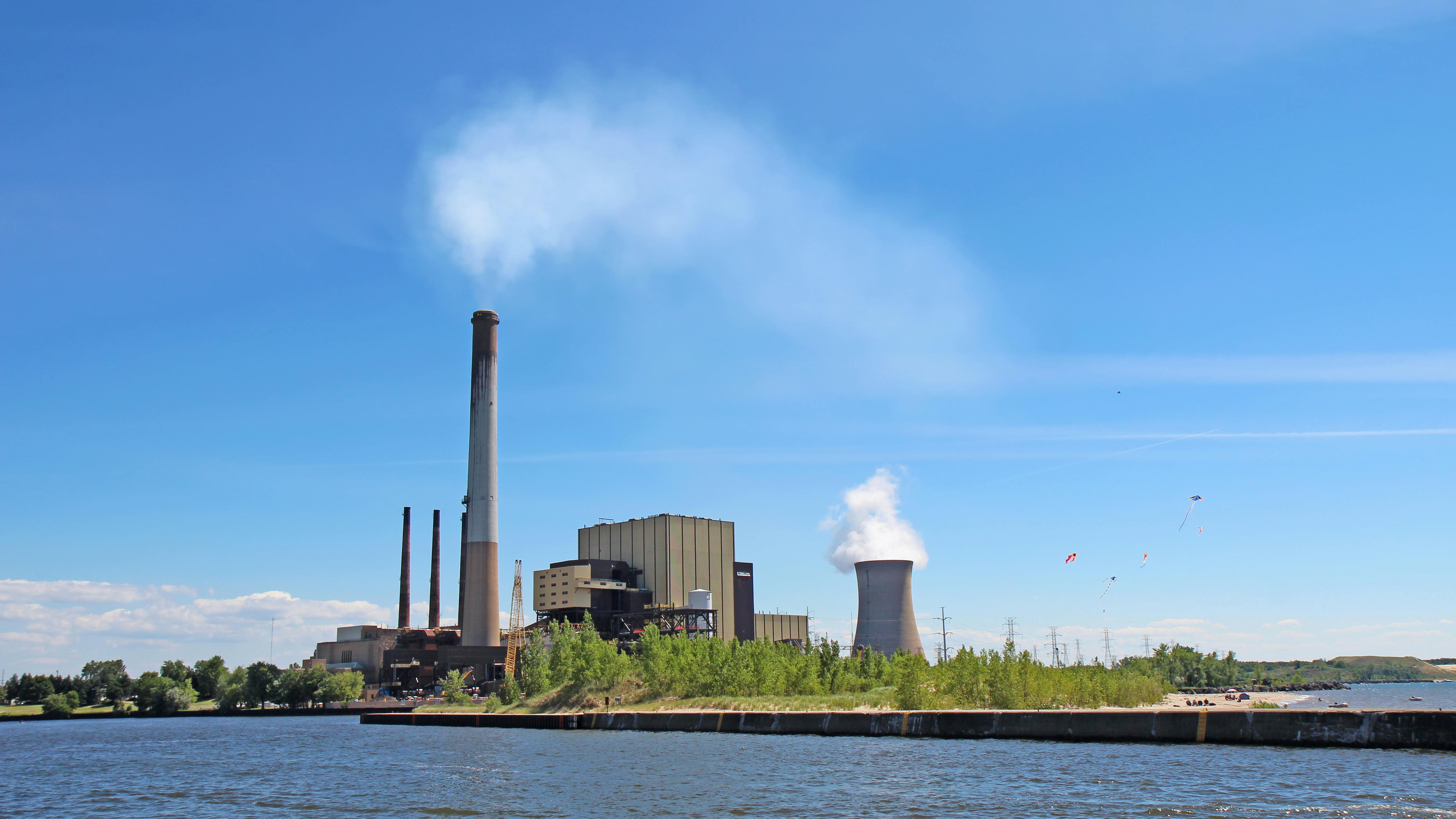 Power plant on Lake Michigan in Indiana. Coal- and gas-fired power plant of the Michigan City Generating Station and public beach on the shore of Lake Michigan near Michigan City, Indiana