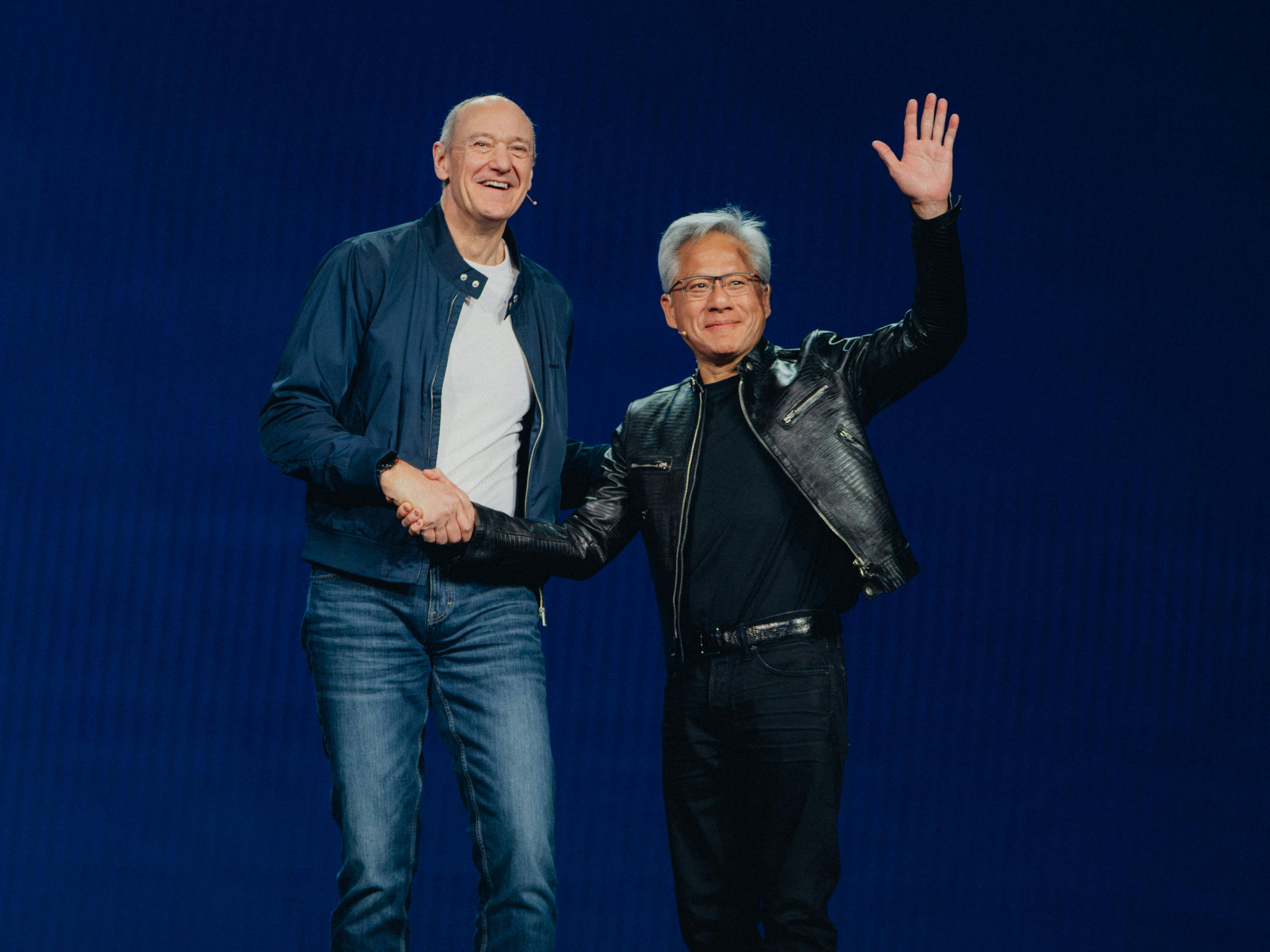 Roland Busch (L), president and CEO of Siemens AG, and Jensen Huang (R), founder and CEO of NVIDIA, announce the expansion of their partnership at CES 2026.