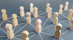 Wooden people connected by lines representing collaboration and cooperation. Wooden people connected by lines representing collaboration and cooperation.