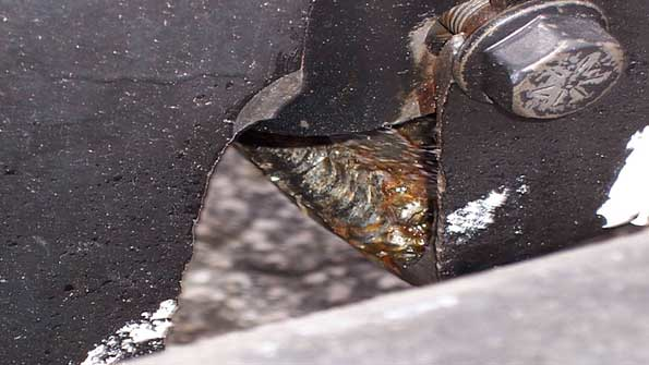 The frame had been welded across on the top side of the lower flange