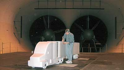 An aerodynamics engineer conducts a windtunnel test on a 25scale model at SOLUS Solutions and Technologies LLC