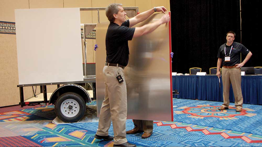 Brent Bystrom demonstrates how quickly a van trailer can be assembled