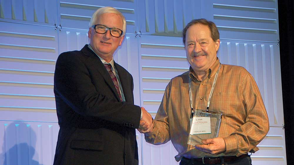 NATM President Greg Snyder presents the 2017 NATM Outstanding Member Award to Lynn Beal Big Tex Trailers Beal has served multiple terms on the NATM board of directors beginning in 2002 and has served on various committees since becoming involved in the association