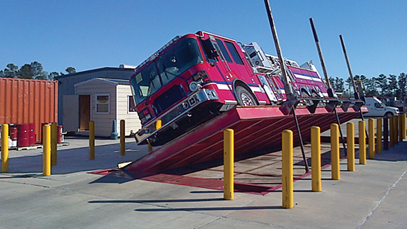 Ferrara Fire Apparatus Holden LA uses a tilt table to test the rollover resistance of the vehicles it manufactures