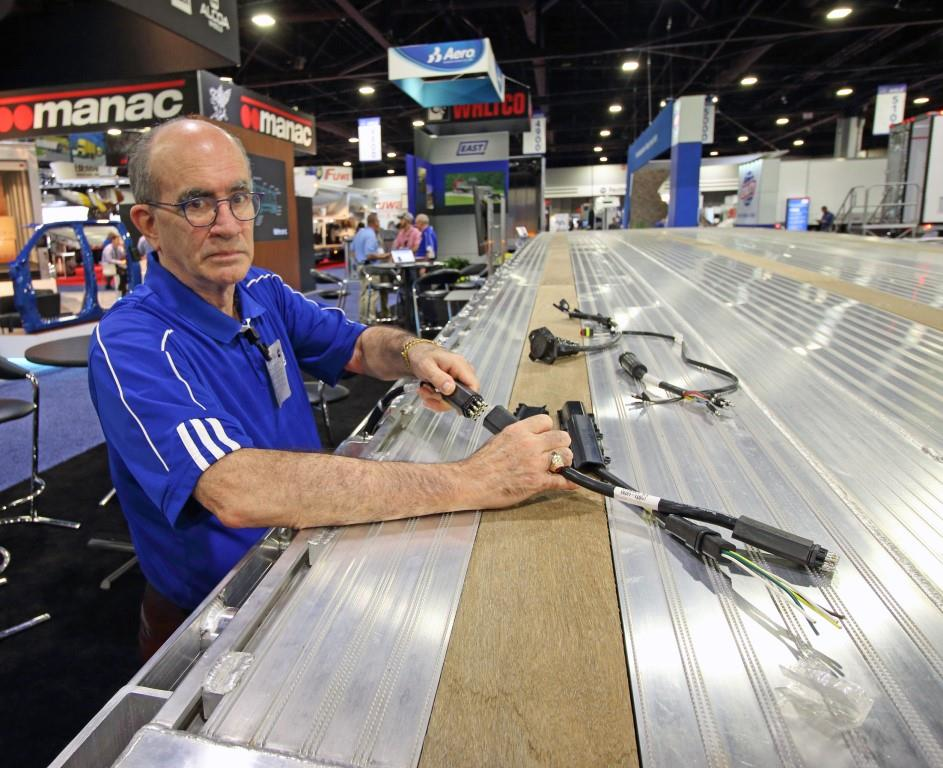 Bill Wallace East product manager for platform products and Northeast regional manager shows some of the components of the new TruckLite 99 Series wiring harness