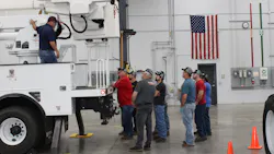 Technicians listen during a demonstration at Terex Utilities' service training. Technicians listen during a demonstration at Terex Utilities' service training.