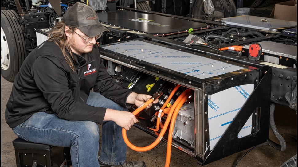 A Fontaine Modification technician routes high-voltage wiring on a chassis at the company&rsquo;s modification center in Mineral Wells, West Virginia.