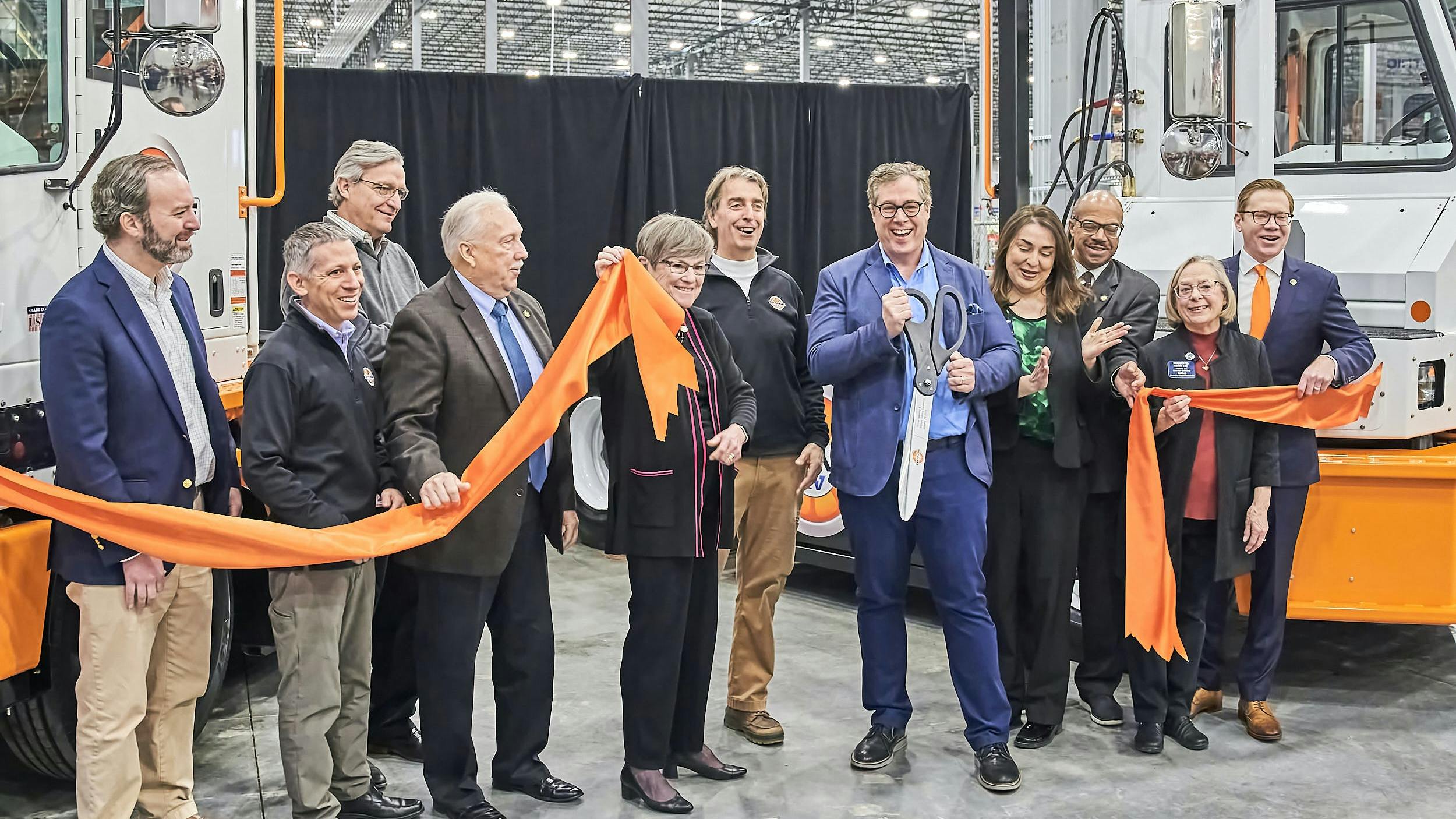 Orange EV leaders and local and statewide officials from Kansas celebrate the electric OEM&rsquo;s new headquarters in Kansas City.