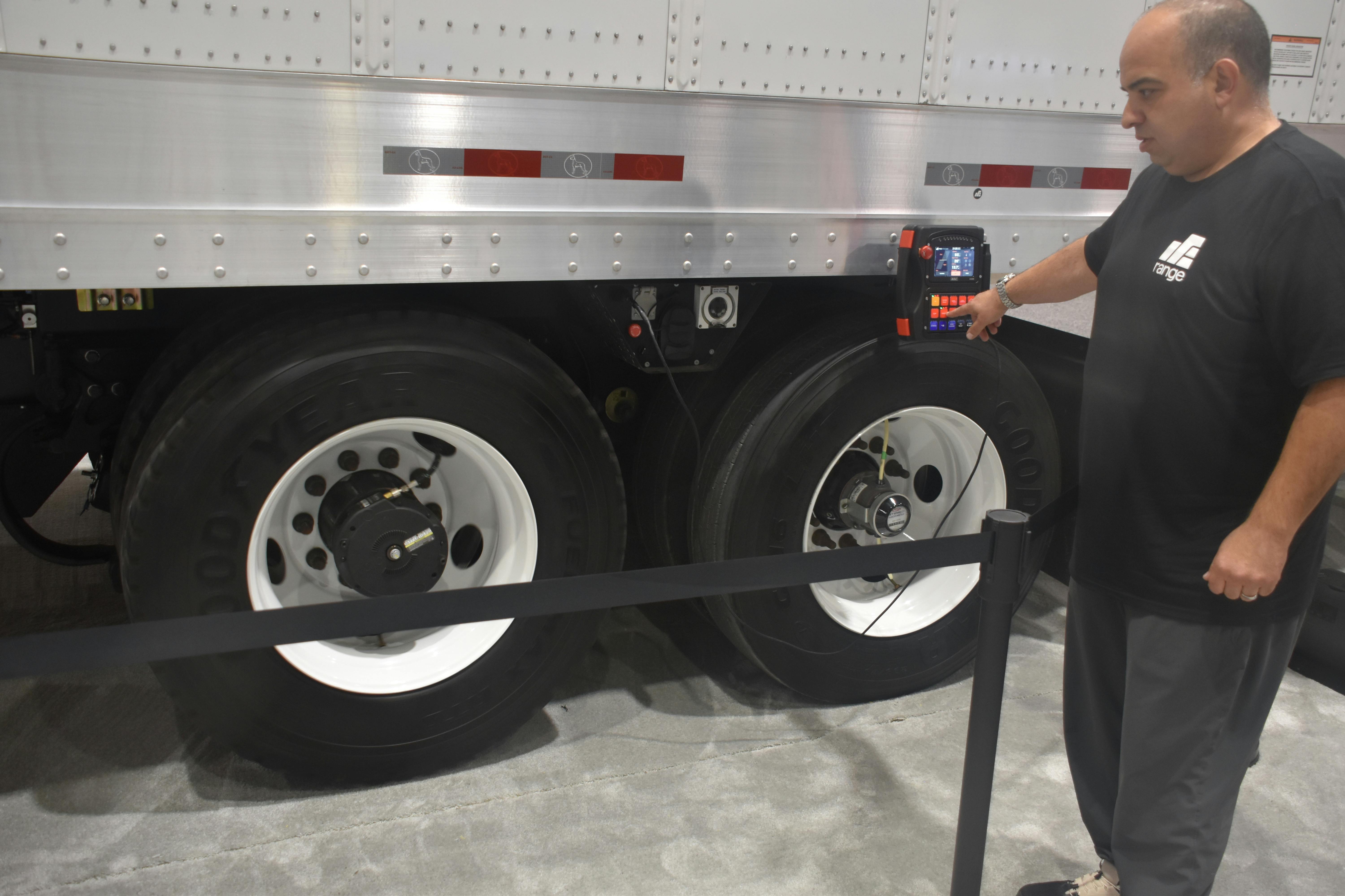 Ali Javidan, CEO and founder of Range Energy, demonstrates the drive unit at TMC.