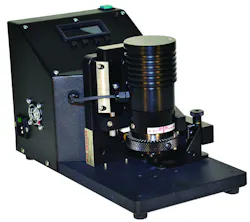 Figure 2: An operator bores into a metal sample to expose a crater in the paint thickness, enabling the capture of multiple images for measurement. Figure 2: An operator bores into a metal sample to expose a crater in the paint thickness, enabling the capture of multiple images for measurement.
