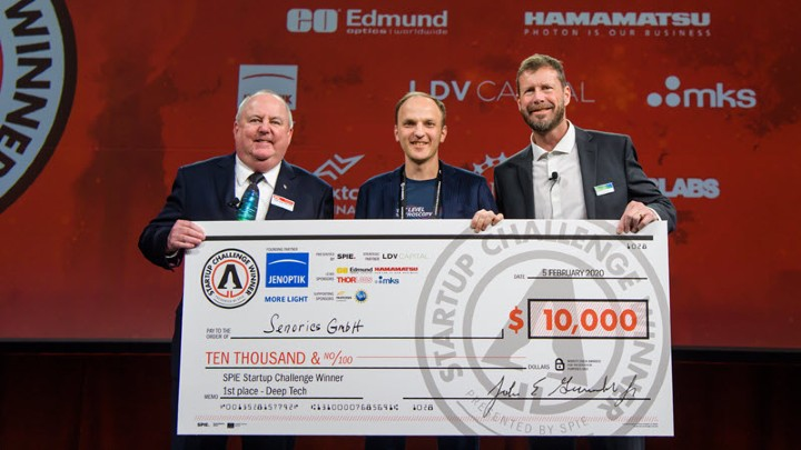 CEO of Senorics Ronny Timmreck, center, receives the first-place prize in the 2020 SPIE Startup Challenge from then-SPIE President John Greivenkamp, left, and Jenoptik Optical Systems President Jay Kumler.