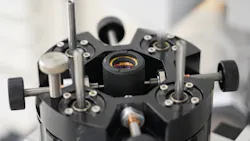 Figure 4: Manual adjustment of an element within a microscope objective during active alignment. These types of adjustments would not be made during the assembly of a drop together system. Figure 4: Manual adjustment of an element within a microscope objective during active alignment. These types of adjustments would not be made during the assembly of a drop together system.