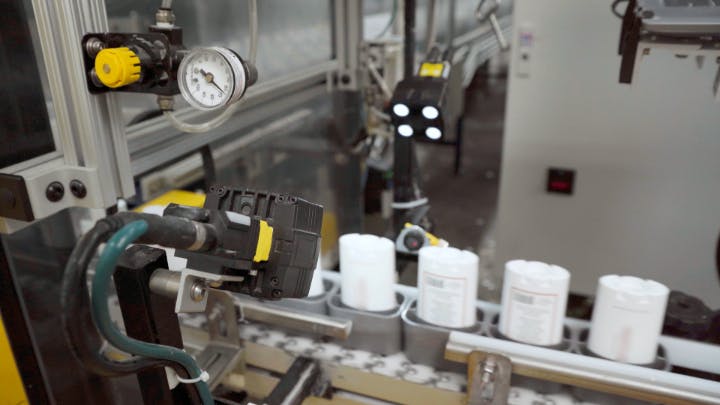 Figure 1: Vision system classifies cosmetic defects on deodorant containers.