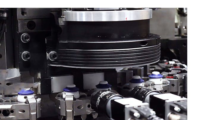 The inspection system checks bottle caps for cracks and flaws.