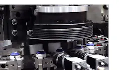 The inspection system checks bottle caps for cracks and flaws. The inspection system checks bottle caps for cracks and flaws.