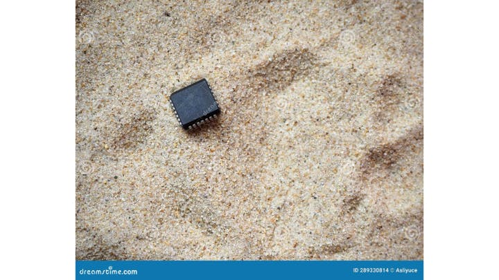 A semiconductor chip in a bed of high quality quartz sand. High quality quartz is a key component in the manufacture of semiconductors.