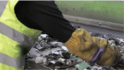 Fig. 3: An employee working a recycling line. At Sweeep's Sittingbourne, England, electronic/electrical recycling facility, human employees sift through waste material to salvage valuable recyclables and remove rubbish such as batteries. The detection system helps them locate and remove batteries, Fig. 3: An employee working a recycling line. At Sweeep's Sittingbourne, England, electronic/electrical recycling facility, human employees sift through waste material to salvage valuable recyclables and remove rubbish such as batteries. The detection system helps them locate and remove batteries,