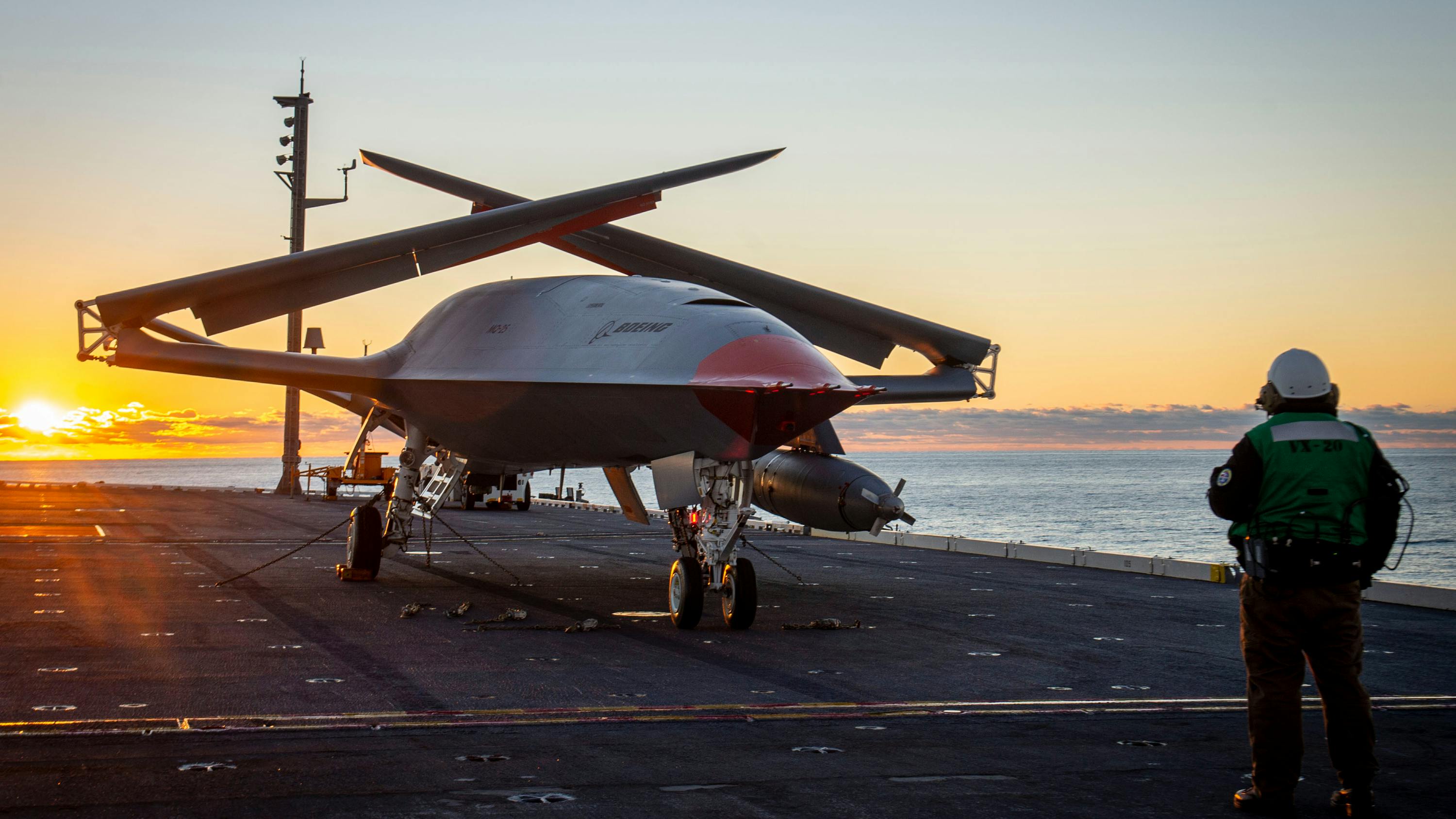unmanned MQ-25 aircraft rests aboard the flight deck aboard the aircraft carrier USS George H.W. Bush