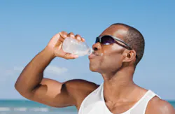 African man drinking water bottle African man drinking water bottle