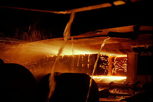End of continuous casting process for steel showing the solid steel being cooled by water | Image courtesy of Greenshoots Communications/Alamy