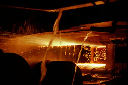 End of continuous casting process for steel showing the solid steel being cooled by water | Image courtesy of Greenshoots Communications/Alamy End of continuous casting process for steel showing the solid steel being cooled by water | Image courtesy of Greenshoots Communications/Alamy