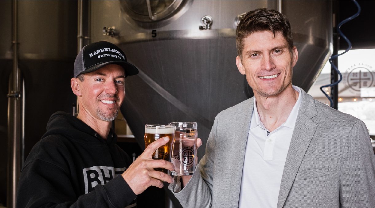 Jason Carvalho President & CEO of BarrelHouse Brewing and Dr. David Stuckenberg COO & Board Vice Chairman of Genesis Systems celebrate the partnership.