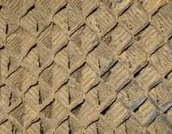 Figure 4a. Cross-fluted tower fill fouled with a slime and silt prior to peroxide cleaning. Figure 4a. Cross-fluted tower fill fouled with a slime and silt prior to peroxide cleaning.