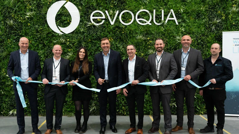 Evoqua team cutting the ribbon at the grand opening event (L-R): Steffen Lange, VP and General Manager of Evoqua's Disinfection Division, Phil Walsh, Plant Manager, Kelly Van Marle, Senior Quality Control Technician, Ron Keating, Chief Executive Officer, Herv&eacute; Fages, Executive Vice President and Applied Product Technologies Segment President, Sean Zyra, Sr. Director of Manufacturing Engineering and Quality, Frans Conradie, Operations Director, and Dave Robinson, Warehouse Supervisor.